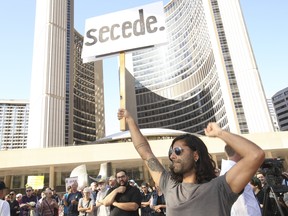 Aly Khan at the anti-Ford protest at Toronto city hall on Wednesday. (Jack Boland/Toronto Sun)