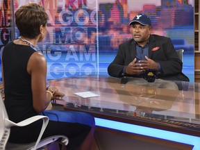 This image released by ABC shows co-host Robin Roberts, left, with "The Cosby Show" actor Geoffrey Owens during an interview on "Good Morning America," Tuesday, Sept. 4, 2018, in New York. (Paula Lobo/ABC via AP)