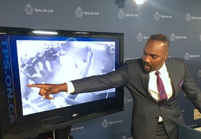 Homicide Det. Leslie Dunkley point out the club patrons who ran away after Kiesingar Gunn, 26, was shot to death in 2014 and urged those witnesses to come forward during a news conference at Toronto Police Headquarters on Tuesday, Sept. 11, 2016. (Chris Doucette/Toronto Sun/Postmedia Network)