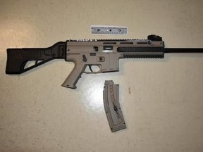 A loaded rifle, a loaded handgun and an assortment of drugs was seized during a traffic stop in Flemingdon Park on Monday, Sept. 3, 2018. (Toronto Police handout)