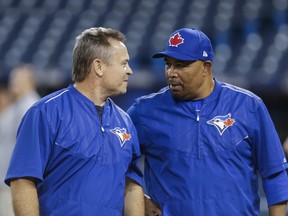 Blues Jays manager John Gibbons (left) and bench coach DeMarlo Hale chat during a team workout. (ERNEST DOROSZUK/TORONTO SUN FILES)