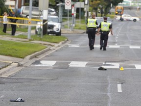 Toronto Police Traffic Services officers were called in to investigate after a man was killed in a hit-and-run on St. Clair Ave. E. just east of Midland Ave., in Scarborough, on Wednesday, Sept. 26, 2018. (Chris Doucette/Toronto Sun/Postmedia Network)