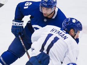 From left: Leafs John Tavares, Zach Hyman and Mitch Marner take part in a skating drill at training camp in Niagara Falls, Ont. over the weekend.(The Canadian Press)