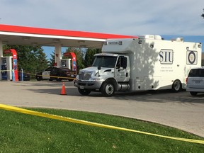 Investigators at the scene of a shooting that injured two Halton Regional Police officers at a Burlington Esso gas station on Sept. 22, 2018. (Kevin Connor/Toronto Sun)