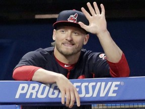 Cleveland Indians' Josh Donaldson waves after arriving in Cleveland as he watches the Indians play the Tampa Bay Rays in the fifth inning of a baseball game, Sept. 1, 2018. (TONY DEJAK/AP)
