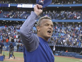 Blue Jays manager John Gibbons salutes the crowd following the team's final game at the Rogers Centre in Toronto on Wednesday, Sept. 26, 2018.