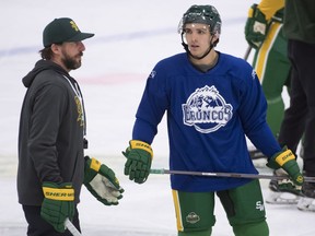 Humboldt Broncos returning player Brayden Camrud speaks with head coach Nathan Oystrick during a practice Tuesday, Sept. 11, 2018.
