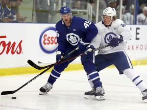 Kasperi Kapanen (right) battles for the puck against Vincent LoVerde during Toronto Maple Leafs training camp in Niagara Falls on Sunday. Dave Abel/Toronto Sun