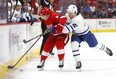 Maple Leafs winger Trevor Moore (right) knocks Red Wings defenceman Joe Hicketts off the puck during pre-season action in Detroit on Saturday.(Paul Sancya/The Associated Press)