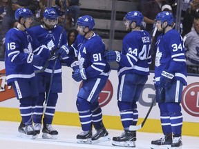 Maple Leafs players, from left, Mitch Marner, Nazem Kadri, John Tavares, Morgan Rielly, and Auston Matthews, celebrate a goal agains the Red Wings during NHL pre-season action in Toronto on Friday, Sept. 28, 2018.