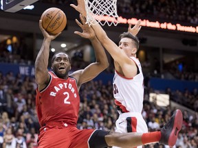 Toronto Raptors forward Kawhi Leonard (2) fights for control of the ball with Portland Trail Blazers forward Zach Collins (33) during pre-season NBA action in Vancouver, Saturday, Sept, 29, 2018. (THE CANADIAN PRESS)