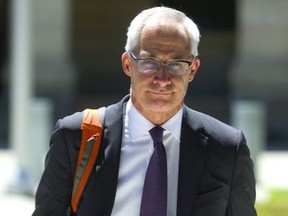 Dr. Dirk Huyer the Chief Coroner for Ontario leaves the Elgin courthouse in St. Thomas during a lunch break during the public inquest into the long term care deaths on Tuesday July 17, 2018.  Mike Hensen/The London Free Press/Postmedia Network