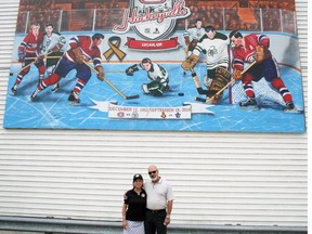 Lucan Biddulph Mayor Cathy Burghardt-Jesson (left) and artist Andrew Gillet stand in front of the "December 15, 1952" mural at the unveiling in Lucan on Sept. 14. Gillet was commissioned to create the mural earlier this year.