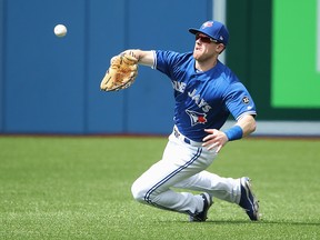 Billy McKinney of the Toronto Blue Jays makes a sliding catch during MLB action against the Baltimore Orioles at Rogers Centre on August 22, 2018 in Toronto. (Tom Szczerbowski/Getty Images)