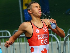 Canadian Tyler Mislawchuk cools down on the run during the men's triathlon at the 2015 Pan Am Games in Toronto Sunday, July 12, 2015. (Dave Abel/Postmedia Network)