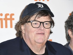 Director Michael Moore at TIFF. His ex-wife is suing him and his new movie is tanking.