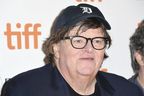 Director Michael Moore at TIFF. His ex-wife is suing him and his new movie is tanking. 