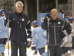 Maple Leafs coach Pat Quinn and assistant coach Keith Acton watch players during a 2005 practice. Toronto Sun files