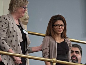 Ensaf Haider, right, wife of Raif Badawi, is comforted by an unidentified woman, after the legislature voted unanimously in favour of a motion to free her husband from a Saudi Arabian jail, during question period Wednesday, February 11, 2015 at the legislature in Quebec City.