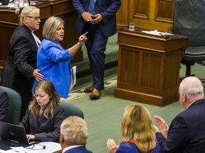 Ontario NDP leader Andrea Horwath gestures at PC MPPs as she is escorted out of the legislature by the Sgt-at-Arms on Wednesday. Ernest Doroszuk/Toronto Sun