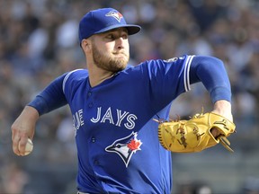 Blue Jays pitcher Sean Reid-Foley delivers a first-inning pitch against the New York Yankees on Sept. 15, 2018, at Yankee Stadium in New York. (BILL KOSTROUN/AP)