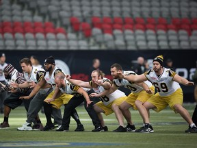 Ticats’ Landon Rice (far right) has returned to Hamilton following a short stint with the Montreal Alouettes. (CP FILE)