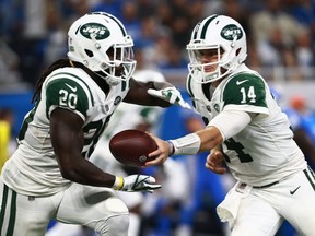 Jets quarterback Sam Darnold (14) hands the ball off to Isaiah Crowell (20) during second half NFL action against the Lions at Ford Field in Detroit on Sept. 10, 2018.