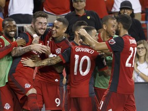 Toronto FC midfielder Jay Chapman (14), second from left, celebrates his goal with his team during the second half of MLS soccer action against the Los Angeles Galaxy at BMO Field on Saturday. 
 THE CANADIAN PRESS/Cole Burston