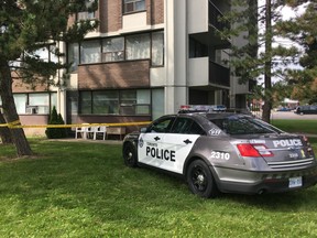 Toronto Police remain at the scene of the city's 76th murder of the year at a highrise on Redgrave Dr., in Etobicoke, on Wednesday, Sept. 12, 2018 (Kevin Connor/Toronto Sun/Postmedia Network)