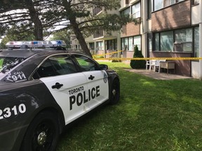 Toronto Police remain at the scene of the city's 76th murder of the year at a highrise on Redgrave Dr., in Etobicoke, on Wednesday, Sept. 12, 2018 (Kevin Connor/Toronto Sun/Postmedia Network)