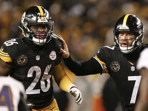 In this Dec. 10, 2017, file photo, Pittsburgh Steelers quarterback Ben Roethlisberger (7) directs running back Le’Veon Bell (26) during the second half of an NFL football game against the Baltimore Ravens in Pittsburgh. (AP Photo/Keith Srakocic, File)