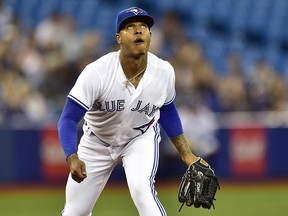Toronto Blue Jays starting pitcher Marcus Stroman (6) eyes a pop fly hit by a Tampa Bay Rays batter in Toronto, Monday, Sept.3, 2018. (THE CANADIAN PRESS/Frank Gunn)