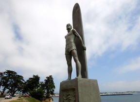 In this Sept. 2, 2005, file photo, a statue that honours surfing stands above Steamer Lane and the boardwalk in Santa Cruz, Calif. (AP Photo/Eric Risberg)