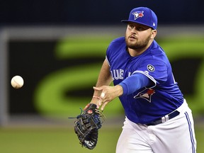 Toronto Blue Jays' Rowdy Tellez throws to relief pitcher Ken Giles (51) during American League action in Toronto, Friday, Sept.7, 2018. (THE CANADIAN PRESS/Frank Gunn)