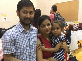 Ashish, his wife Reeva and daughter Shrauya, 4, are among 1,500 or so displaced residents who lost everything in a recent fire at 650 Parliament St. but received some help from donors and the city on Saturday, Sept. 1, 2018. (Joe Warmington/Toronto Sun/Postmedia Network)