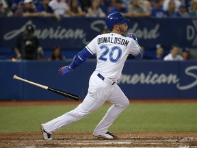Josh Donaldson 3B (20) grounds into a double play for the Jays. Jack Boland/Toronto Sun/Postmedia Network