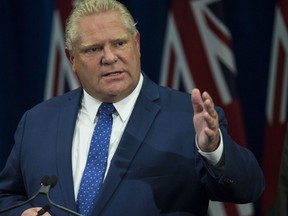 Premier Doug Ford  holds a press conference arguing against the judges ruling about slashing the size of City council  in Toronto, Ont. on Monday. (Craig Robertson/Toronto Sun)