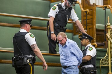 A man in the public gallery is led away in restraints by Queen's Park Special Constables during the morning session in the legislature at Queen's Park in Toronto, Ont. on Wednesday September 12, 2018. Ernest Doroszuk/Toronto Sun/Postmedia