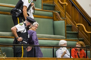 A woman in the public gallery is led away in restraints by Queen's Park Special Constables during the morning session in the legislature at Queen's Park in Toronto, Ont. on Wednesday September 12, 2018. Ernest Doroszuk/Toronto Sun/Postmedia