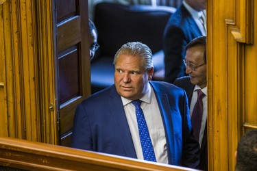 Ontario Premier Doug Ford looks into the chamber during an interruption by hecklers during the morning session in the legislature at Queen's Park in Toronto, Ont. on Wednesday September 12, 2018. Ernest Doroszuk/Toronto Sun/Postmedia