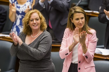 Lisa MacLeod, Minister of Children, Community and Social Services and Minister Responsible for WomenÕs Issues (left) and Ontario Attorney General Caroline Mulroney during the morning session in the legislature at Queen's Park in Toronto, Ont. on Wednesday September 12, 2018. Ernest Doroszuk/Toronto Sun/Postmedia