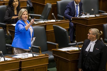 Ontario NDP leader Andrea Horwath is escorted out of the legislature by the Sgt-at-Arms during while she along with most of her MPPs were pounding their desks in protest during the afternoon session in the legislature at Queen's Park in Toronto, Ont. on Wednesday September 12, 2018. Ernest Doroszuk/Toronto Sun/Postmedia