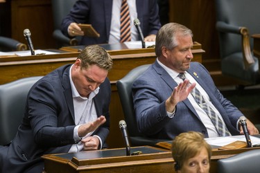Ontario NDP MPPs pounding their desks in protest during the afternoon session in the legislature at Queen's Park in Toronto, Ont. on Wednesday September 12, 2018. Ernest Doroszuk/Toronto Sun/Postmedia