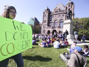 Over 100 students, parents and supporters sat on the front lawn of the Ontario Legislature on Saturday to tell the Ford government they want the new Sex Ed curriculum brought back (Jack Boland/Toronto Sun)