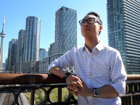 Ward 10 council candidate Kevin Vuong on the Bathurst Bridge overlooking Toronto, Ont. on Friday September 28, 2018. (Dave Abel/Toronto Sun)