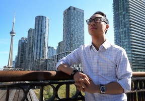 Ward 10 council candidate Kevin Vuong on the Bathurst Bridge overlooking Toronto on Friday, Sept. 28, 2018. (Dave Abel/Toronto Sun)