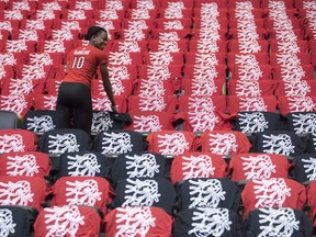 T-shirts are laid out on the seats of the Air Canada Centre as preparations are made for the Toronto Raptors' opening game against the Milwaukee Bucks for the NBA playoffs, in Toronto on Saturday, April 15, 2017.  THE CANADIAN PRESS/Chris Young