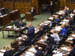 Ontario Premier Doug Ford, centre, speaks in question period in side the legislature at Queen's Park in Toronto on Monday, Sept. 17, 2018. (Nathan Denette/The Canadian Press)