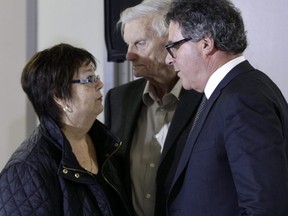 Donna and Doug French, parents of murdered teen Kristen French, speak to lawyer Tim Danson, right, at Wednesday's parole hearing for convicted killer and rapist Paul Bernardo. (Ernest Doroszuk/Toronto Sun)