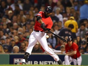 Jackie Bradley Jr. #19 of the Boston Red Sox hits a single to left center field during the third inning of Game Two of the American League Division Series against the New York Yankees  at Fenway Park on October 6, 2018 in Boston, Massachusetts.s.